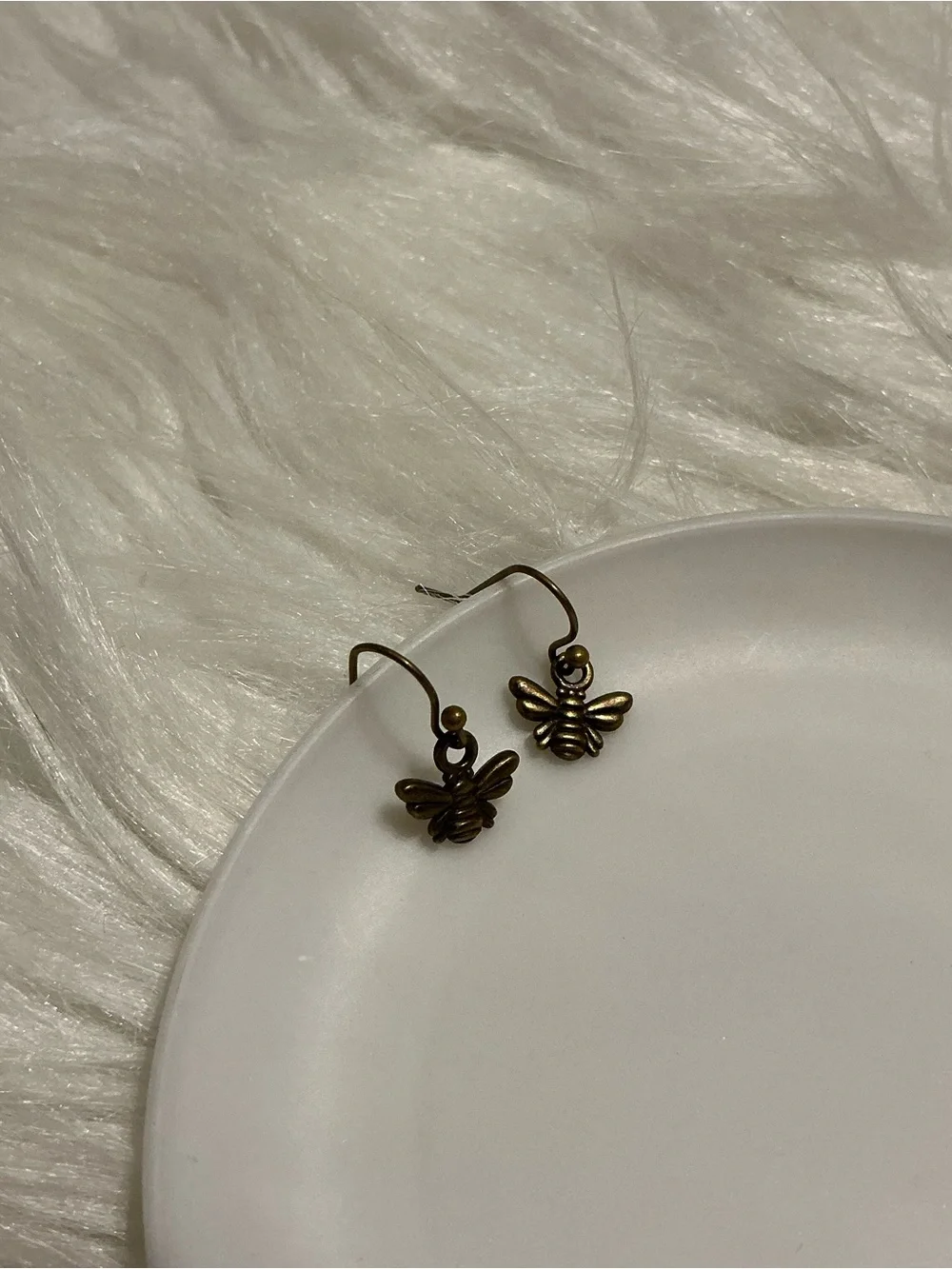 Tiny bronze bee dangle earrings